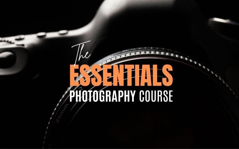 The Essentials Photography Course title over a close up of a camera lens