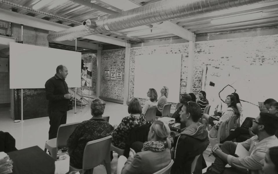 Martin Osner teaching a group of students at the photography school